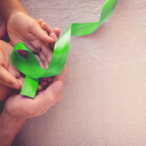 hands hold lime green lyme awareness ribbon